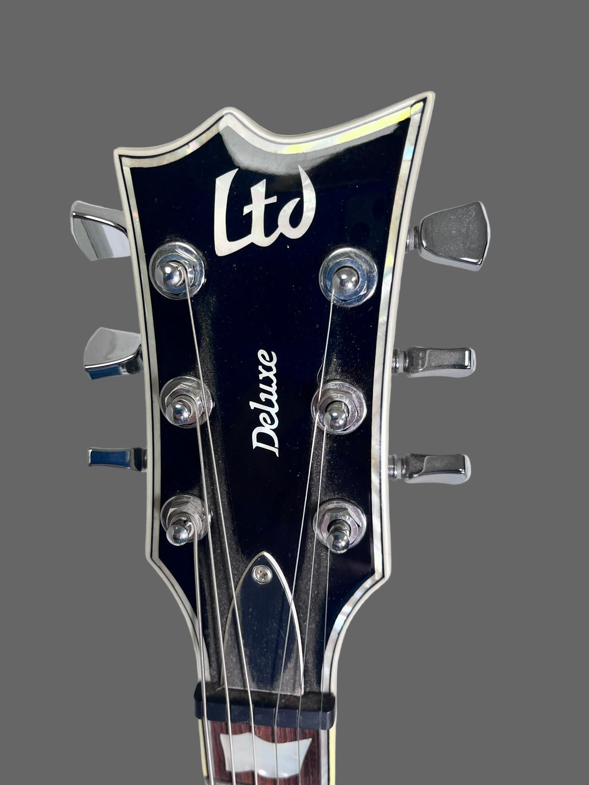 Used ESP LTD Deluxe w/evertune Bridge Black w Pearl Binding