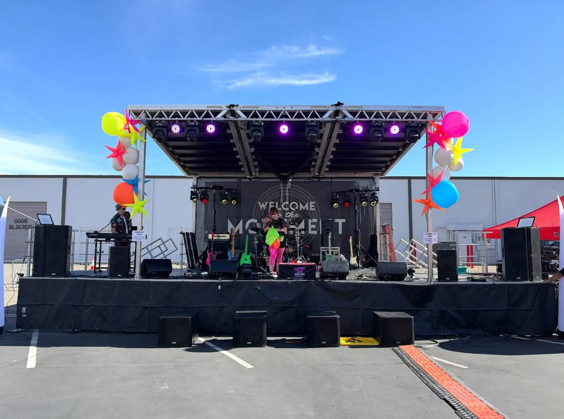 SL75 mobile stage with band setting up